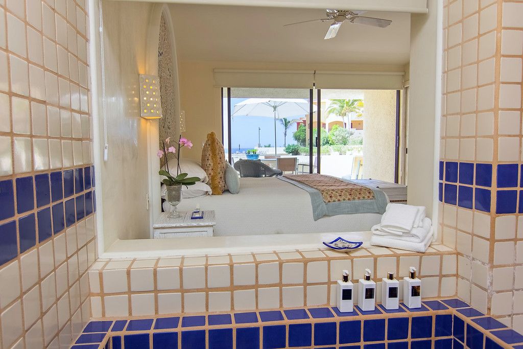 master bathroom and bedroom of terrasol beach resort condo for rent in cabo san lucas